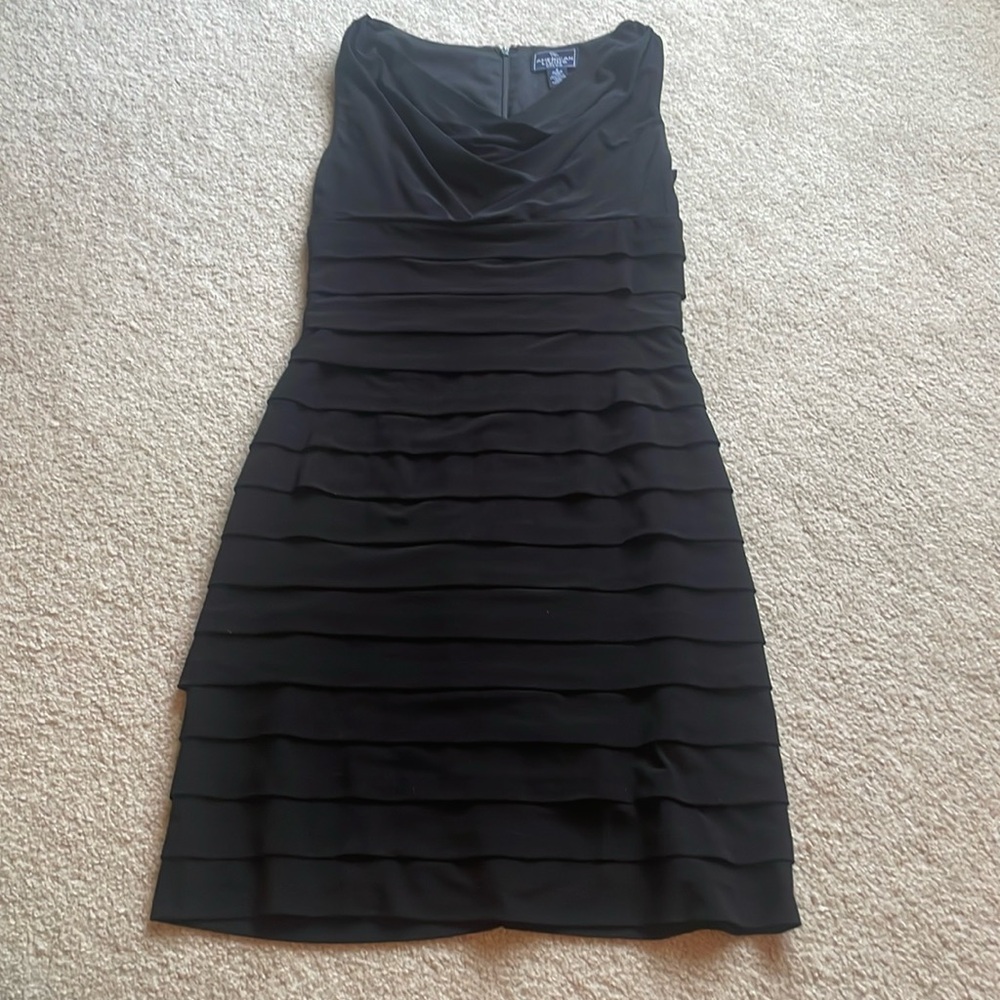 Perfect little black dress with scoop neck and flutter tiers.